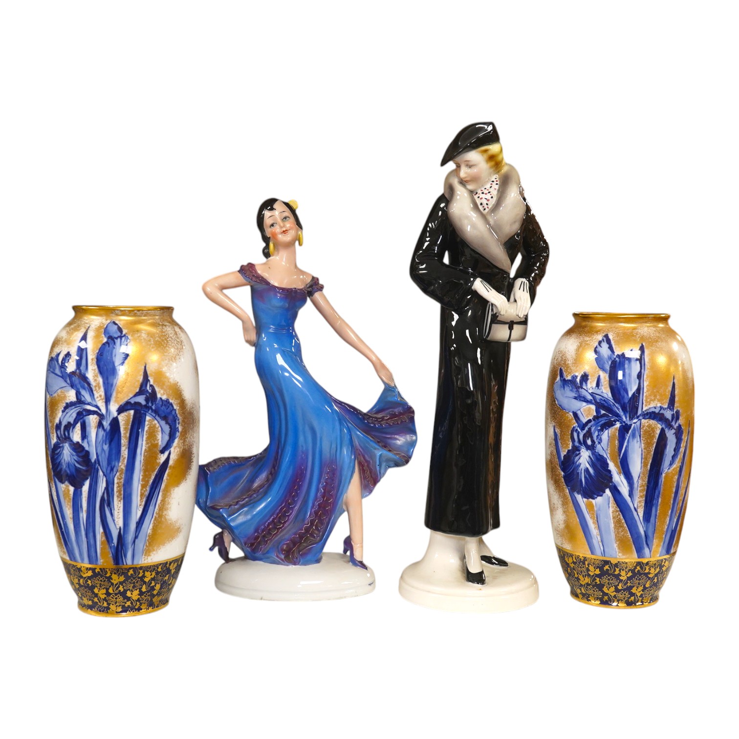 A pair of Royal Doulton vases decorated with irises and a gilt background, 19cm high, and two Art Deco pottery figurines, one marked foreign, tallest 32cm. Condition - fair to good.